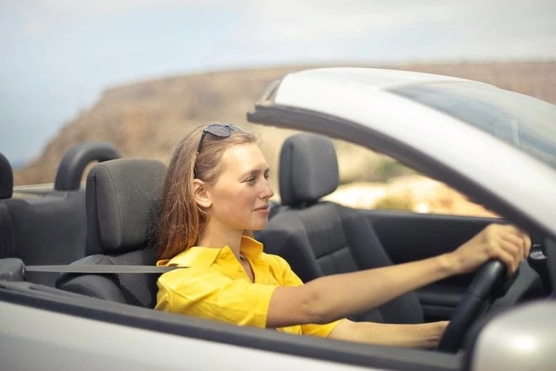 image of a girl driving car